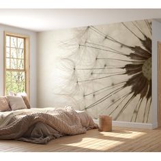 a bedroom with a dandelion wall mural in the corner and wooden flooring