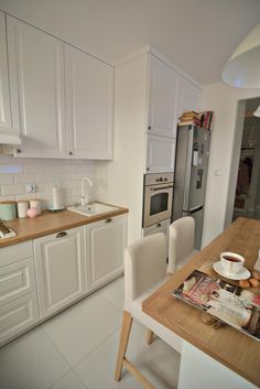 the kitchen is clean and ready to be used for breakfast or dinner time, as well as other things that are on the table