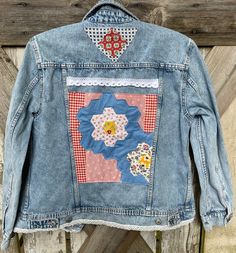 Washed and distressed denim jean jacket embellished with vintage quilt blocks and other fun fabrics and a bit of lace.  Size M.  It's 20" across the chest.  One of a kind. Funky Denim Jackets, Applique Jean Jacket, Cotton Denim Jacket With Patchwork In Medium Wash, Retro Cotton Patchwork Denim Jacket, Retro Patchwork Denim Jacket, Medium Wash Cotton Denim Jacket With Patchwork, Retro Cotton Denim Jacket With Patchwork, Vintage Patchwork Denim Jacket In Medium Wash, Vintage Denim Patchwork Outerwear