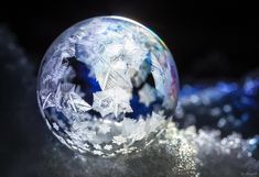 a crystal ball with snow flakes on it