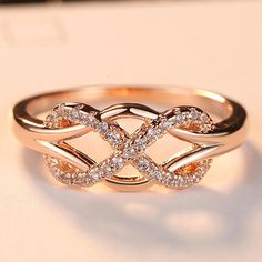 a gold ring with diamonds on top and the words clear crystal written in white letters