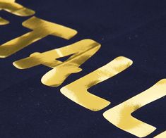 the word japan is written in gold on a dark blue background