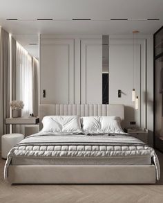 a large white bed sitting in a bedroom next to a tall mirror on the wall