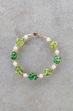 "Gold Filled and Luminous Crackle Glass Handmade Beaded Bracelet, 7.5\". All 4mm round beads and lobster clasp are gold filled. Green beads are 12mm crackle glass glow in the dark beads.  Spacer beads are teal glow in the dark beads. Really pretty bracelet during day as well as at night! Check out my other jewelry at https://loveofjewelryshop.etsy.com" Green Nickel Free Bracelets With Round Beads, Nickel-free Green Beaded Bracelets, Dark Bracelet, Glow In The Dark Beads, Bracelet Business, Fun Bracelet, Hippie Bracelets, Green Beads, Crackle Glass