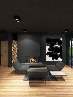 a modern living room with wood flooring and black walls, along with a fireplace