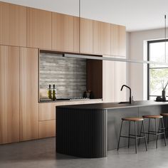 a modern kitchen with wooden cabinets and stools