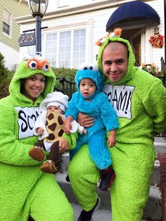 two men and a baby dressed in costumes