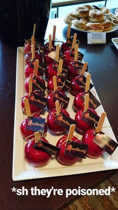 there are many apples on the table with name tags