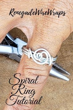 a hand holding a pair of scissors with the words spiral ring tutorial on it