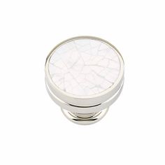 a white cabinet knob with cracky glass in the center on an isolated white background