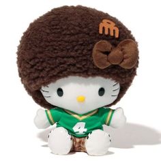 a hello kitty stuffed animal wearing a football jersey and beanie with the number 4 on it