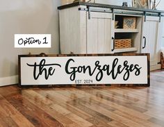 a wooden sign that says the gorselsesss sitting on top of a hard wood floor