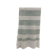 a gray and white striped towel hanging on a wall