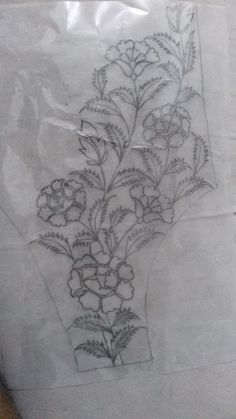 a drawing of flowers in a vase on a piece of paper