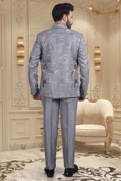 This elegant short sherwani is a luxurious addition to any gentleman's wardrobe. With a beautifully crafted thread embroidery open jacket, this mens sherwani exudes sophistication and exclusivity. Perfect for special occasions and formal events, it is the epitome of refined style. Elevate your look with this M42-S117 sherwani. Elegant Gray Sets With Zari Work, Elegant Gray Kurta With Resham Embroidery, Elegant Gray Festive Sets, Elegant Gray Sets For Eid, Festive Fitted Gray Set, Fitted Gray Sets For Festive Occasions, Fitted Gray Set For Festive Occasions, Elegant Gray Kurta For Eid, Fitted Gray Sets For Eid