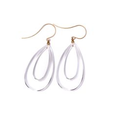 Crystal clear teardrop shaped donut earrings. Drop shaped hoop, made with lucite that looks like glass, but weights almost nothing. Each measures 2.5" in length. Earwires are frosted 24k gold plated over base metal. Earrings are made with vintage lucite parts that were made in Rhode Island in the 1960's - early 80's by Best Plastics. We hand-set them with surgical steel earring posts and they have sturdy surgical steel/acrylic backings on them as well. White Drop Hoop Earrings, Modern Clear Teardrop Earrings, Modern White Teardrop Hoop Earrings, Modern White Lucite Jewelry, Modern White Teardrop Earrings, Modern Clear Teardrop Jewelry, Clear Teardrop Earrings For Pierced Ears, Everyday Clear Teardrop Earrings, Clear Teardrop Earrings