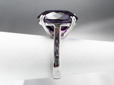 This exceptional amethyst commands attention! Generous in size, this gemstone sparkles with juicy hues of violet, fuchsia, and royal purple. A simple setting of 18 karat white gold lets the amethyst be the star of the show. Metal: 18K White Gold Gem: Amethyst 12.20 Carats Gem Measurements: 12.9 x 16.9 mm, Oval Ring Size: 6.25 Marks: "750" Stamped on the inside band Yellow Gold Sapphire Ring, Amethyst Cocktail Ring, Right Hand Ring, Cameo Ring, Gold Cocktail, Right Hand Rings, Hand Ring, Oval Ring, Purple Band