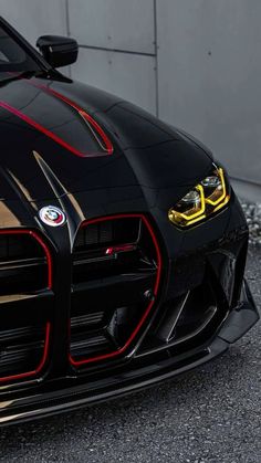 the front end of a black sports car