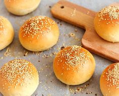 sesame seed buns on a baking sheet