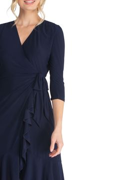 A surplice neckline reveals as little or as much as you want to accentuate on a fab dress that's playfully chic and delightfully drapey. 95% polyester, 5% spandex Machine wash, dry flat Made in the USA of imported fabric Evening V-neck Faux Wrap Dress, Dressy V-neck Dress With Surplice Neckline For Evening, Elegant V-neck Faux Wrap Dress, Flowy V-neck Dress With Surplice Neckline For Date Night, Dinner Dresses With Ruched Surplice Neckline, Elegant Fitted Wrap Dress With V-neck, Elegant Fitted V-neck Wrap Dress, Flowy Ruched Midi Dress With Surplice Neckline, Elegant Fitted Wrap Dress With Surplice Neckline