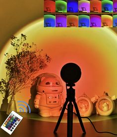 a tripod is set up in front of a wall with many different colored lights