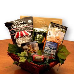 a basket filled with food and snacks on top of a table