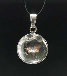 STERLING SILVER PENDANT. ,APPROXIMATE WEIGHT 2.6 GRAMS,, DIAMETER 1.9CM . All our jewels are made from solid sterling silver 925/1000 and are carefully crafted by hand in our family workshop.We dispatch your orders in 5 working days, worldwide and the postage is $5. We ship registered priority mail. Please allow 5-7 working days for delivery in Europe and 10-15 working days outside Europe.For any questions – please do not hesitate to contact me! Hammered Sterling Silver Round Pendant, Sterling Silver Shiny Jewelry, Sterling Silver Shiny Finish Jewelry, Hammered Sterling Silver Round Pendant Jewelry, Silver Hammered Pendant Jewelry, Shiny Sterling Silver Jewelry, Silver Pendant Jewelry With Shiny Finish, Sterling Silver Coin Pendant Jewelry, Silver Jewelry With Large Round Disc Pendant