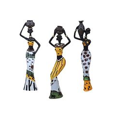 three ceramic figurines are standing in the shape of women