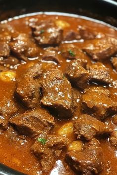 a close up of a stew in a pot