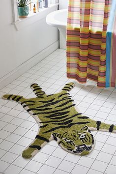 a tiger rug on the floor in a bathroom