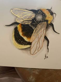 a drawing of a bee on a piece of paper