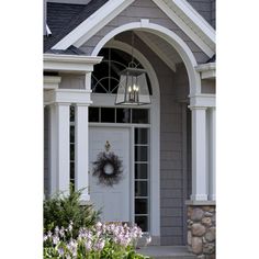 a house with a wreath on the front door