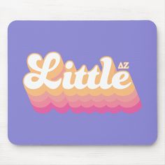 a mouse pad with the word little in white and orange letters on purple, blue background