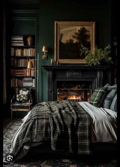 a bedroom with dark green walls and a fireplace in the corner is decorated with bookshelves