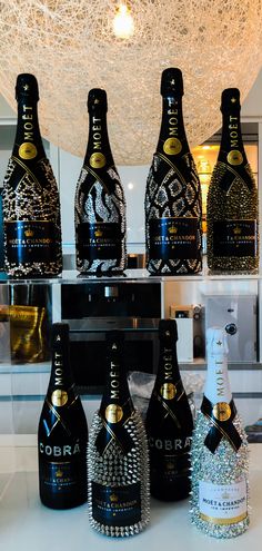 four bottles of champagne are sitting on a counter