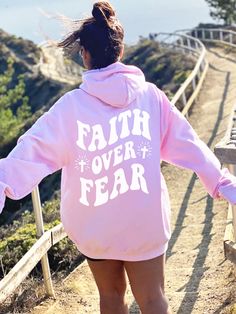 Spread a Message of Faith with this cute Faith Over Fear Hoodie! This unique Christian Hoodie Sweatshirt is super comfy! Size up for a Trendy Oversized Look! SHIPS FREE! EXPEDITED SHIPPING RECOMMENDED for “BEST CHANCE” of Christmas Delivery. All items are made to order. Please allow for printing time (approx 2-6 days including weekends - 4 days on average) SAT DEC 14TH - MON DEC 16TH: Upgrade to UPS GROUND at CheckoutTUES DEC 17TH - THURS DEC 19TH: Upgrade to UPS 2ND DAY at Checkout (*If you liv Cute Oversized Hoodie For Fall, Fall Slogan Hoodie For Loungewear, Pink Winter Slogan Hoodie, Pink Winter Hoodie With Slogan, Winter Pink Hoodie With Slogan, Cute Oversized Hoodie With Letter Print, Oversized Hooded Top With Slogan, Long Sleeve Hoodie With Slogan For Spring, Cute Letter Print Hoodie For Loungewear