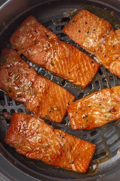 cooked salmon being cooked in an air fryer