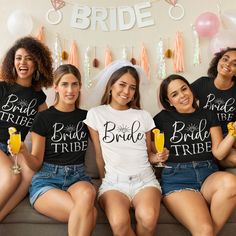 the bridesmaids are all wearing matching t - shirts and posing for a photo