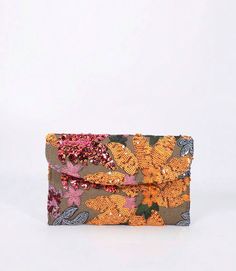 This Sequin Embroidered Flap Clutch features a unique and eye-catching random pattern design. The intricate sequin embroidery adds a touch of sparkle to any outfit. With a convenient flap closure, this clutch is perfect for a night out or a formal event. Sequin Clutch, Random Pattern, Sequin Embroidery, Jumpsuits And Romper, Sequins Embroidery, Poncho Sweater, Mardi Gras, Blue Gold, Formal Event