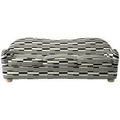 a black and white checkered couch with wooden legs