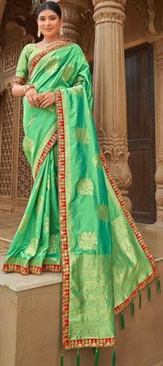 Green color Saree in Banarasi Silk, Silk fabric with Border, Embroidered, Thread, Weaving work Green Embroidered Border Saree For Reception, Green Banarasi Silk Dupatta With Intricate Embroidery, Green Banarasi Silk Traditional Wear With Intricate Embroidery, Green Banarasi Silk Traditional Wear With Embroidery, Festive Pista Green Saree With Embroidered Border, Green Banarasi Silk Saree With Intricate Embroidery, Green Saree With Intricate Embroidery In Art Silk, Green Art Silk Saree With Intricate Embroidery, Pista Green Saree With Embroidered Border