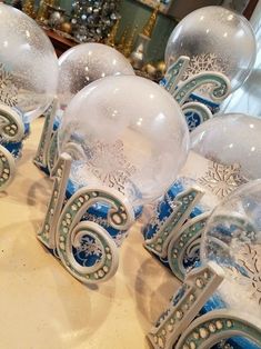 several snow globes sitting on top of a table