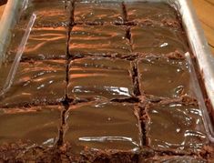 a pan filled with brownies sitting on top of a table