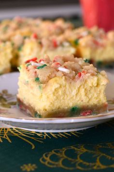 two pieces of cake sitting on top of a white plate next to a red cup