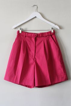 Raspberry pink pleat front city shorts with a matching belt and side pockets. Buttoned back pocket. Label: Northern Isles Measurements: Waist 29' Length 19' Hem opening  13.5' Fabric: Poly / Cotton blend Condition: Excellent Smock Blouse, City Shorts, Raspberry Pink, Dramatic Look, Carbon Footprint, Long Shorts, Aztec Print, Lovely Dresses, No Frills