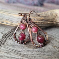 Stone Beaded Dangle Earrings -handcrafted unique design with a bohemian feel -made of solid patina copper -featuring pretty watermelon tourmaline stone -woven wire wrap detail -classic teardrop shape -lightweight and comfortable for everyday wear or that special occasion -great gift idea for the woman who loves artisan jewelry -copper plated brass ear hooks - nickel free, lead free and cadmium free Size:  1.75 inches long (measurement includes the ear hook) .75 inch wide. See more handmade artis Patina Copper, Wire Wrap Jewelry, Jewelry Design Inspiration, Wire Jewelry Designs, Wrapped Earrings, Earrings Antique, Teardrop Dangle Earrings, Wrap Jewelry, Diy Wire Jewelry