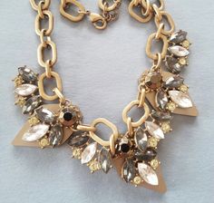 A beautiful rhinestone and goldtone necklace. This is a lovely vintage piece, acquired from an estate in New Jersey in the United States.  Please note this is a vintage piece, with normal wear and tear for its age. In excellent condition. Gold Jeweled Bridal Necklace For Party, Gold Bridal Necklace With 17 Jewels In Crystal, Vintage Gold Rhinestone Necklace With Sparkling Stones, Gold Crystal Necklace Costume Jewelry, Gold Crystal Necklaces For Formal Occasions, Glamorous Gold Crystal Necklaces For Parties, Gold Crystal Necklaces With Sparkling Stones For Wedding, Gold Crystal Costume Jewelry Necklace, Gold Crystal Necklace For Formal Costume Jewelry