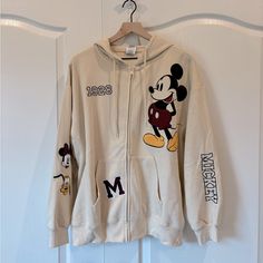 Brand New With Tags White Cotton Mickey Mouse Sweatshirt, Fall Streetwear Mickey Mouse Tops, Disney Cotton Sweatshirt For Winter, Winter Disney Cotton Sweatshirt, Disney Cotton Hoodie For Streetwear, Disney Cotton Sweatshirt With Embroidered Graphics, Mickey Mouse Cotton Hooded Top, Cotton Mickey Mouse Hooded Top, Cotton Hooded Top With Mickey Mouse