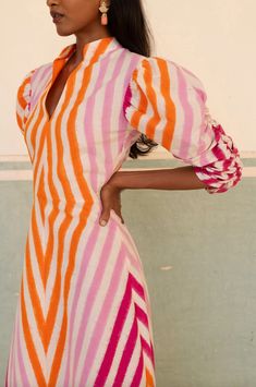 The Multicolor Illusion dress is made of double Ikat from the south of India. This playful maxi dress features white, orange, rose and fucsia stripes, mandarin collar and puff gathered sleeves. Full length Fitted 100% handloom cotton Dry clean only Made in India Gul Hurgel, Adriana Degreas, Illusion Dress, Ikat Print, Gathered Sleeves, Band Collar, Traditional Indian, Mandarin Collar, Shoe Sale