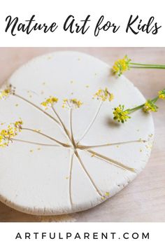 a white plate with yellow flowers on it and the words nature art for kids above it